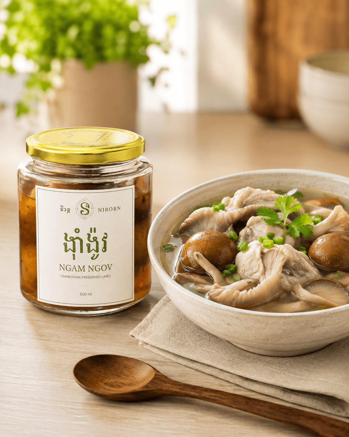 A jar of Ngam Ngov and a bowl of chicken soup with oyster mushroom